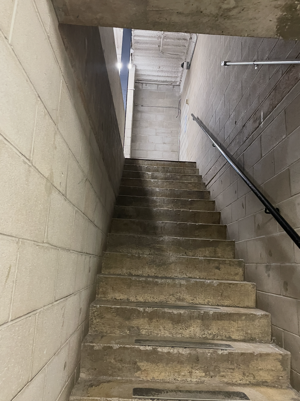 This is a staircase that leads up to the AA wing. It is used to get around the school and can let you move around while its raining. The staircase is dark and moody with brick walls conveying a uneasy feeling making you feel on edge. When I first saw this staircase I thought it looked like a dungeon.<a href='https://www.youtube.com/embed/tgbNymZ7vqY' target='_blank'><p>Project Video Link</p></a>